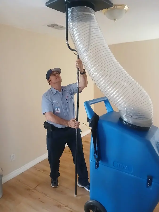 Furnace Tune-Up technician using HEPA equipment in East Pasadena